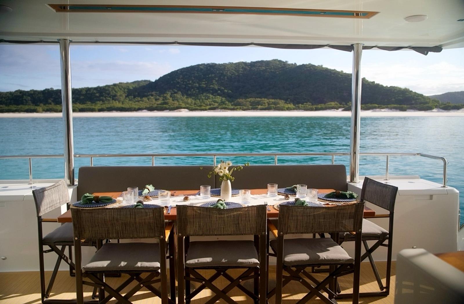 Lunch laid on the aft deck with the islands behind