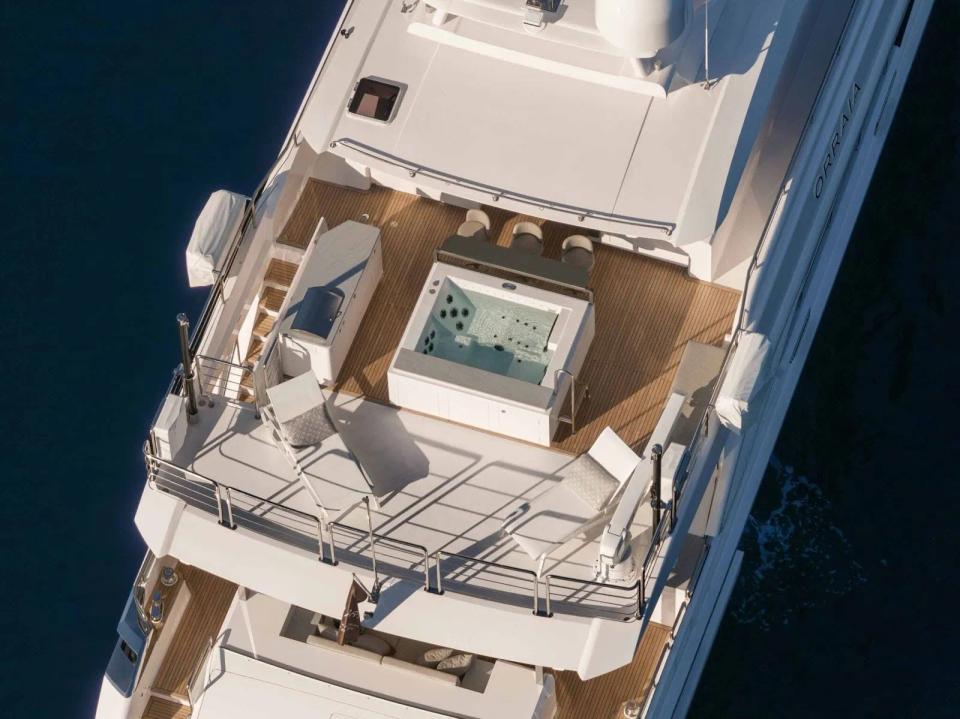 Orraia yacht upper deck with jacuzzi and relaxation area.