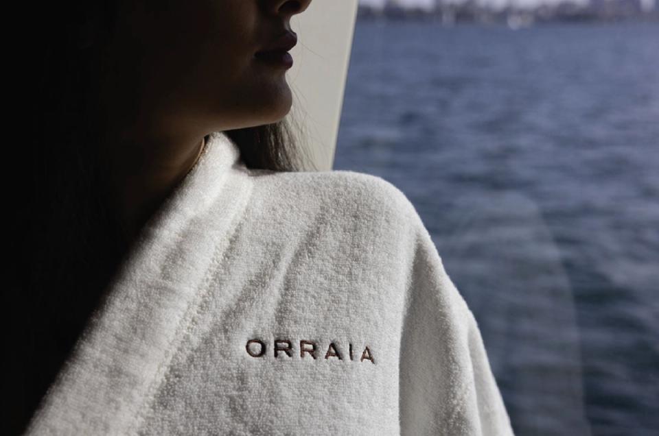 Overnight charter experience on the Orraia yacht, with a robe provided.
