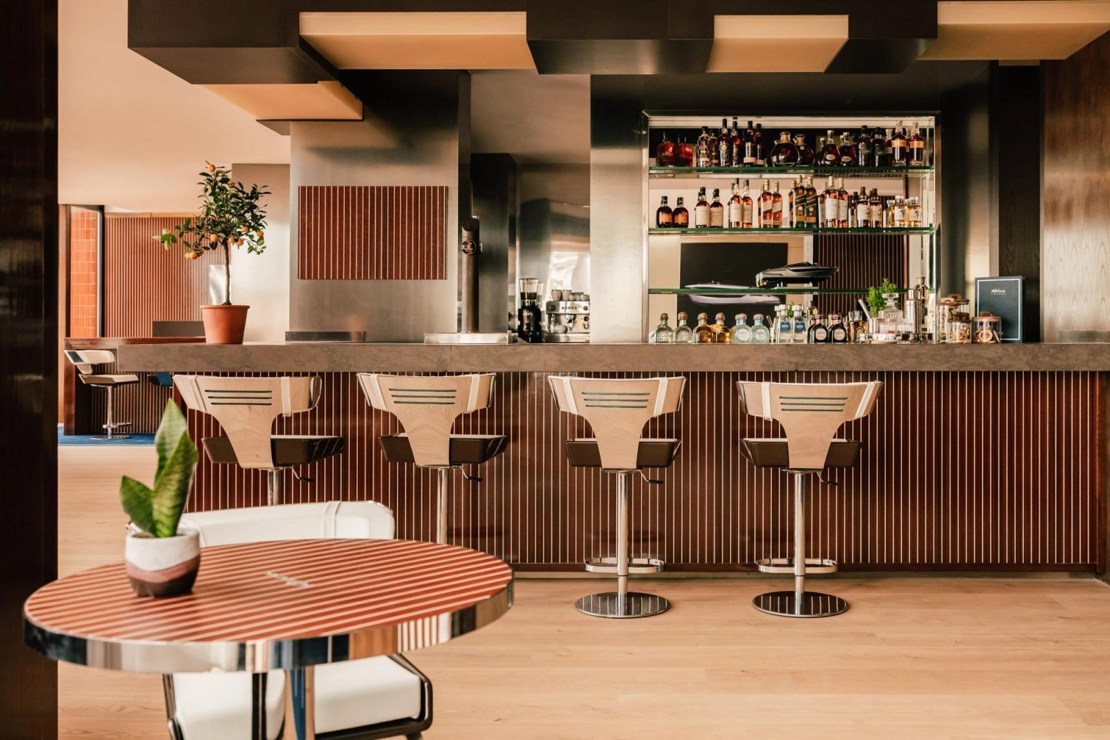 The Riva Lounge bar — mahogany and ribbed maple