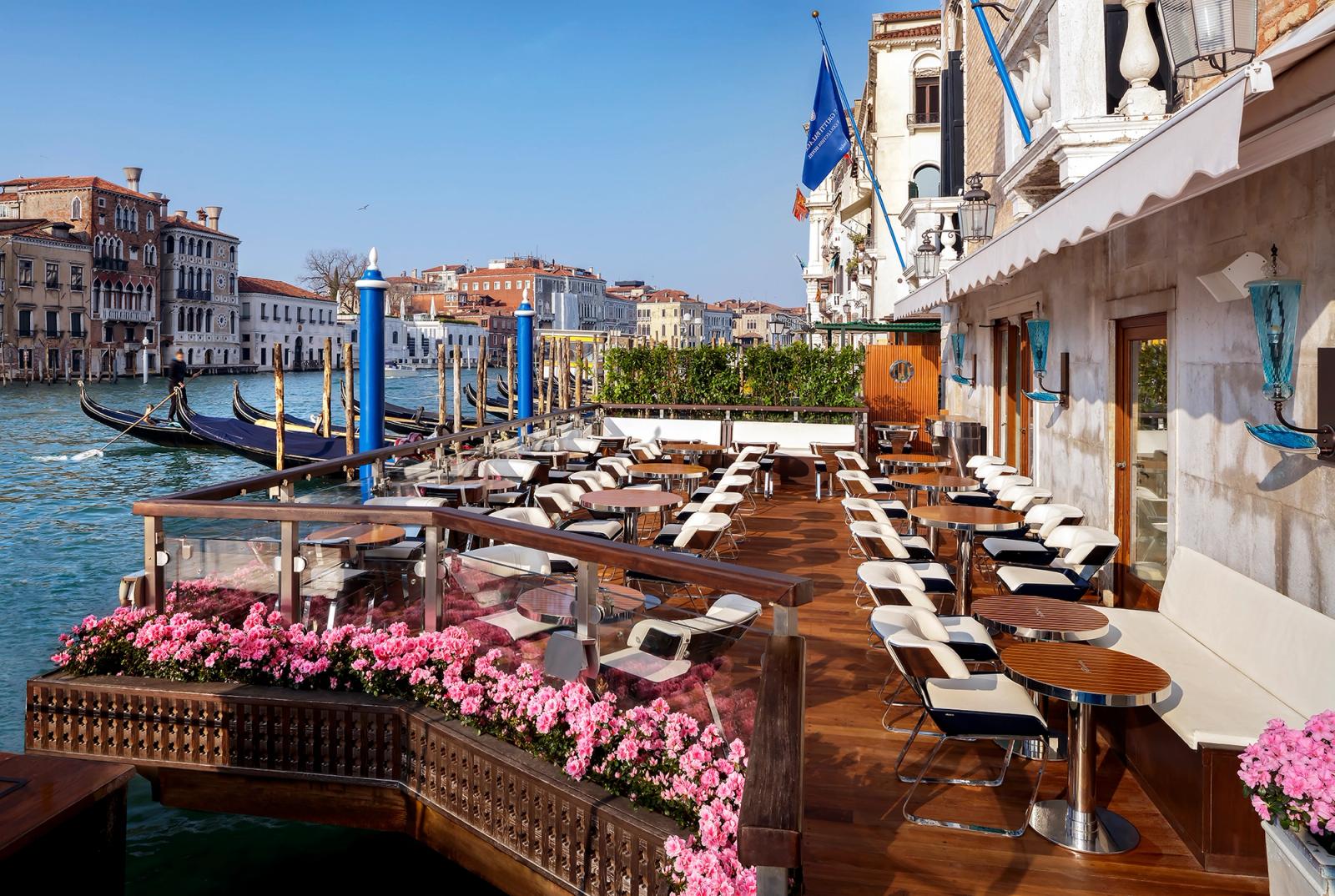 The Riva Lounge terrace — teak decking and chrome at the water's edge