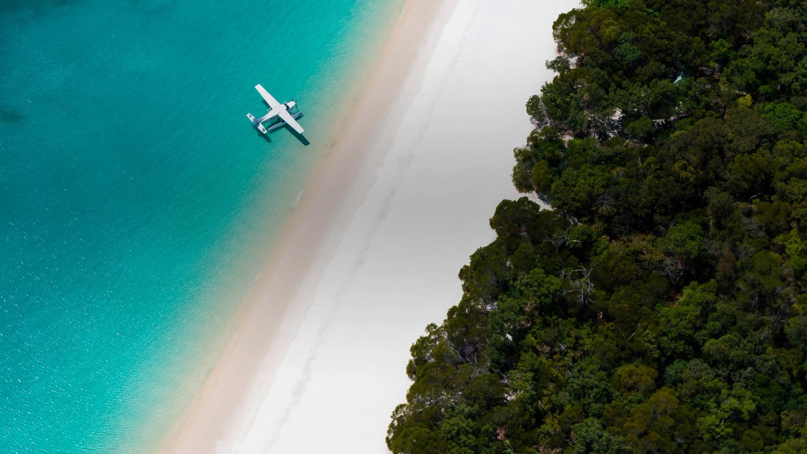 A seaplane over Whitehaven Beach
