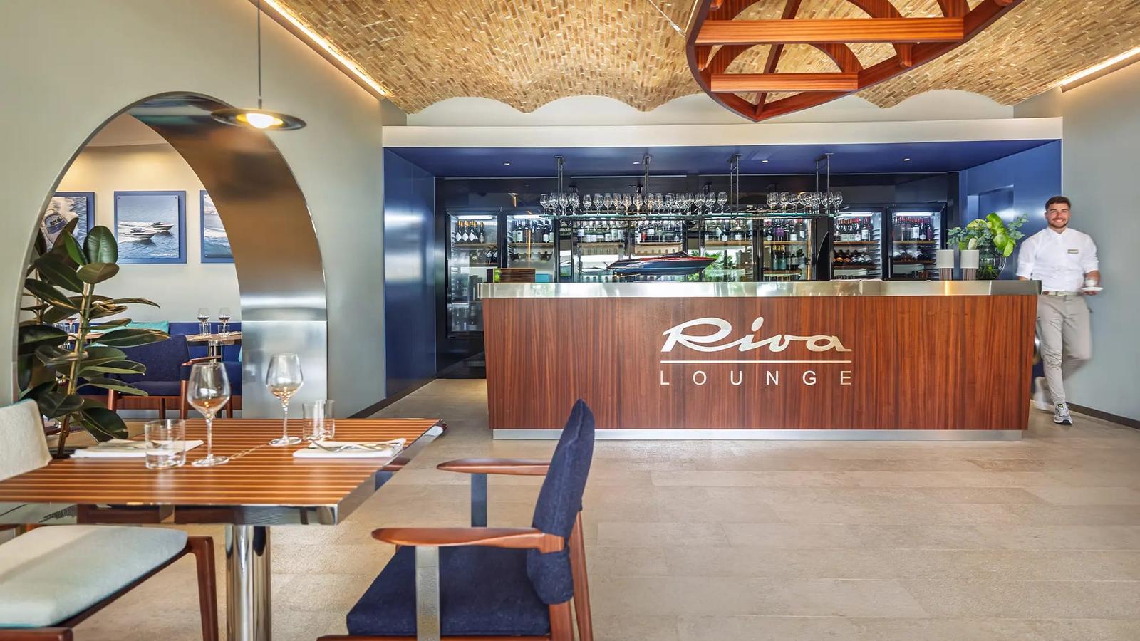 The Riva Lounge bar — the yard's mahogany and chrome, ashore