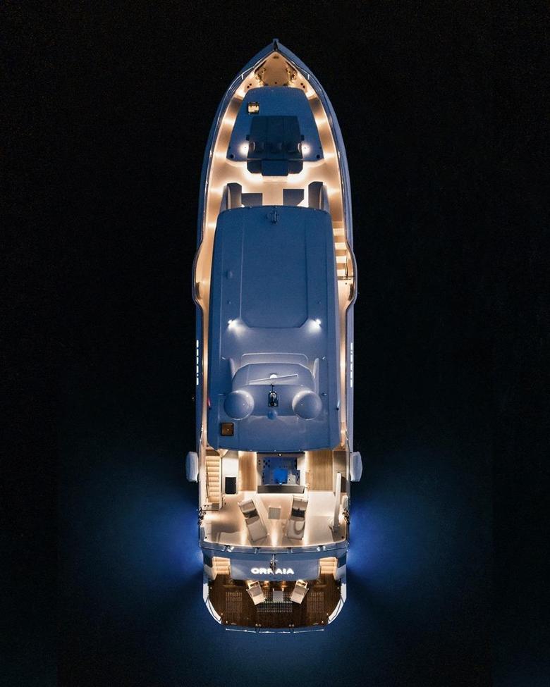 ORRAIA superyacht lit up from above at night, moored dockside