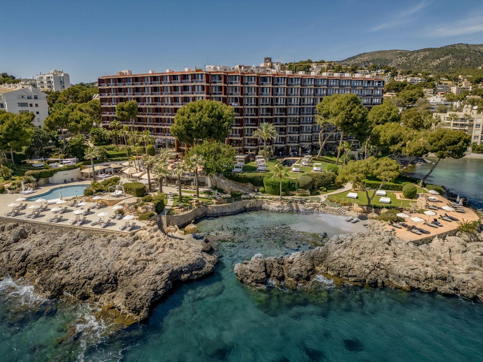Hotel de Mar on its Illetas promontory — the chocolate building above two coves