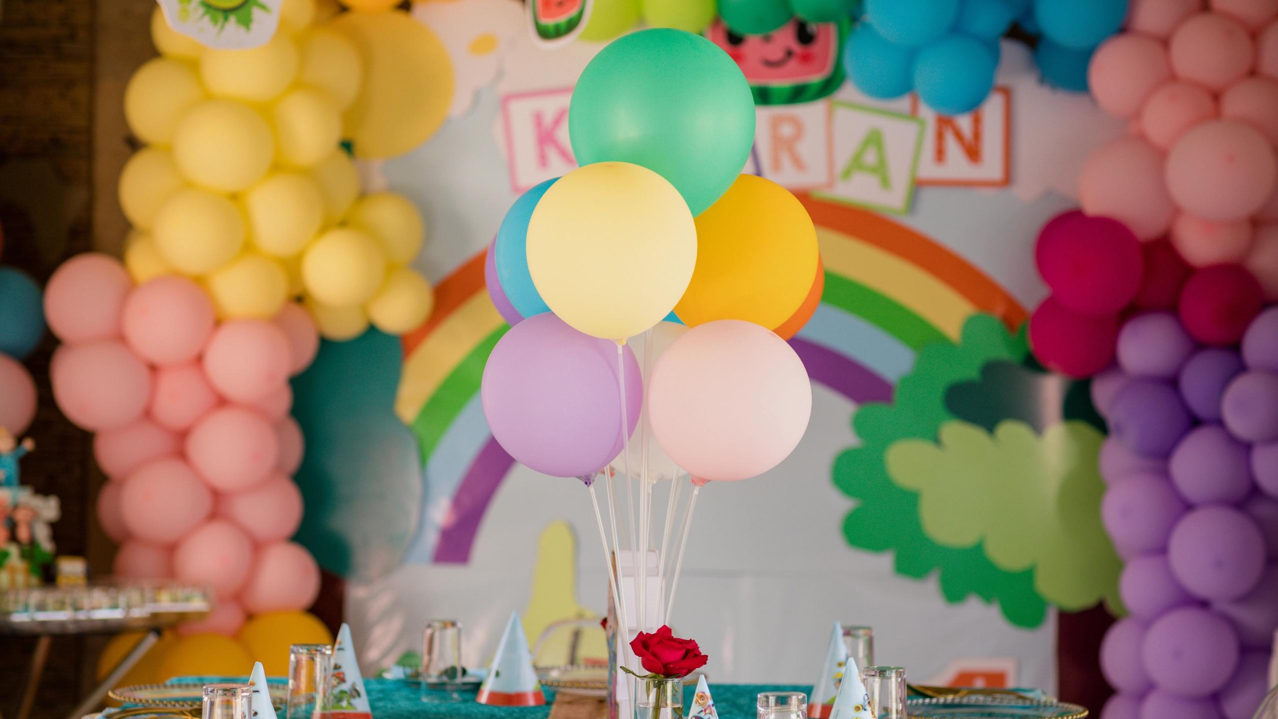 Colourful balloons and party decorations arranged on a party table
