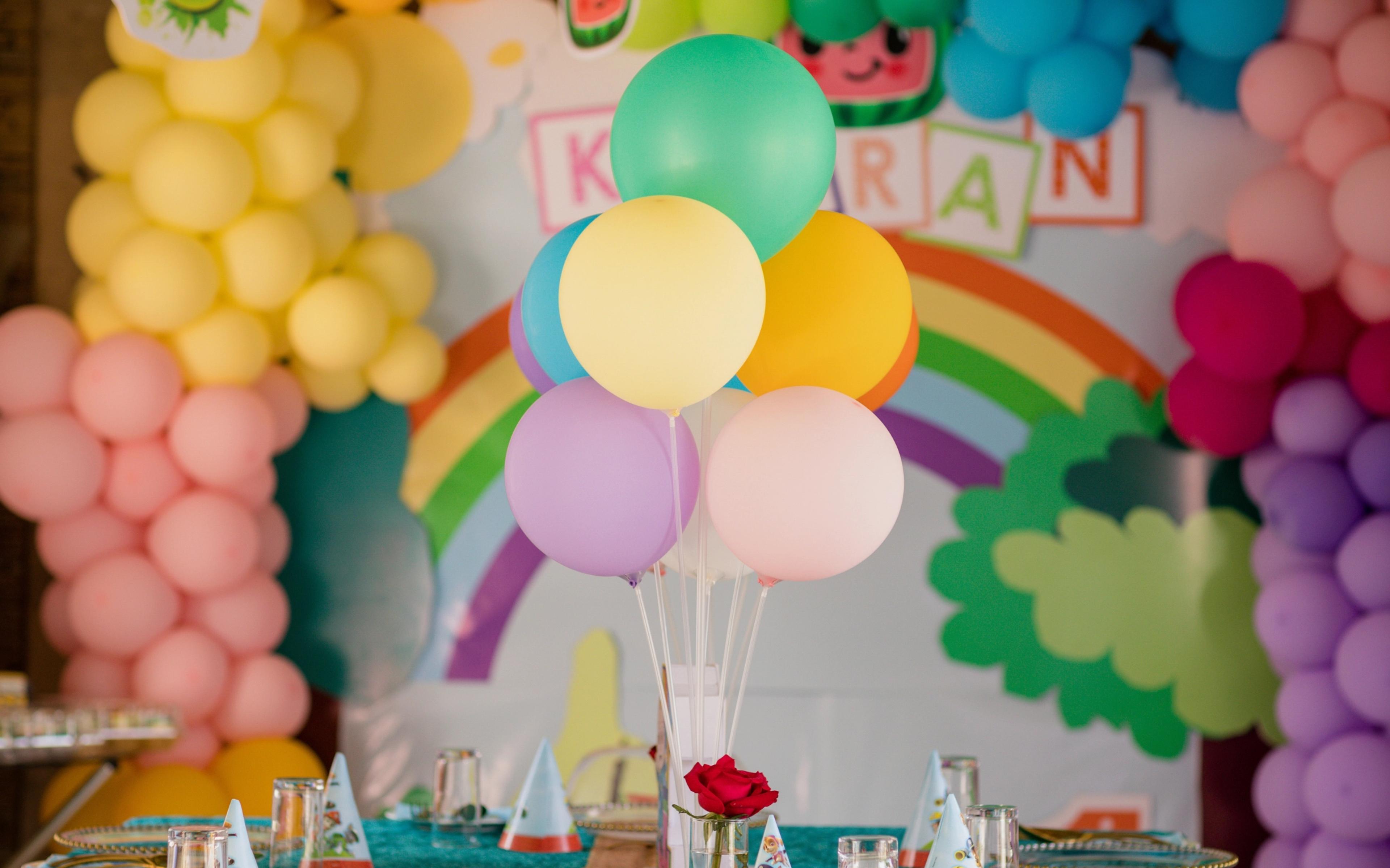 Colourful balloons and party decorations arranged on a party table