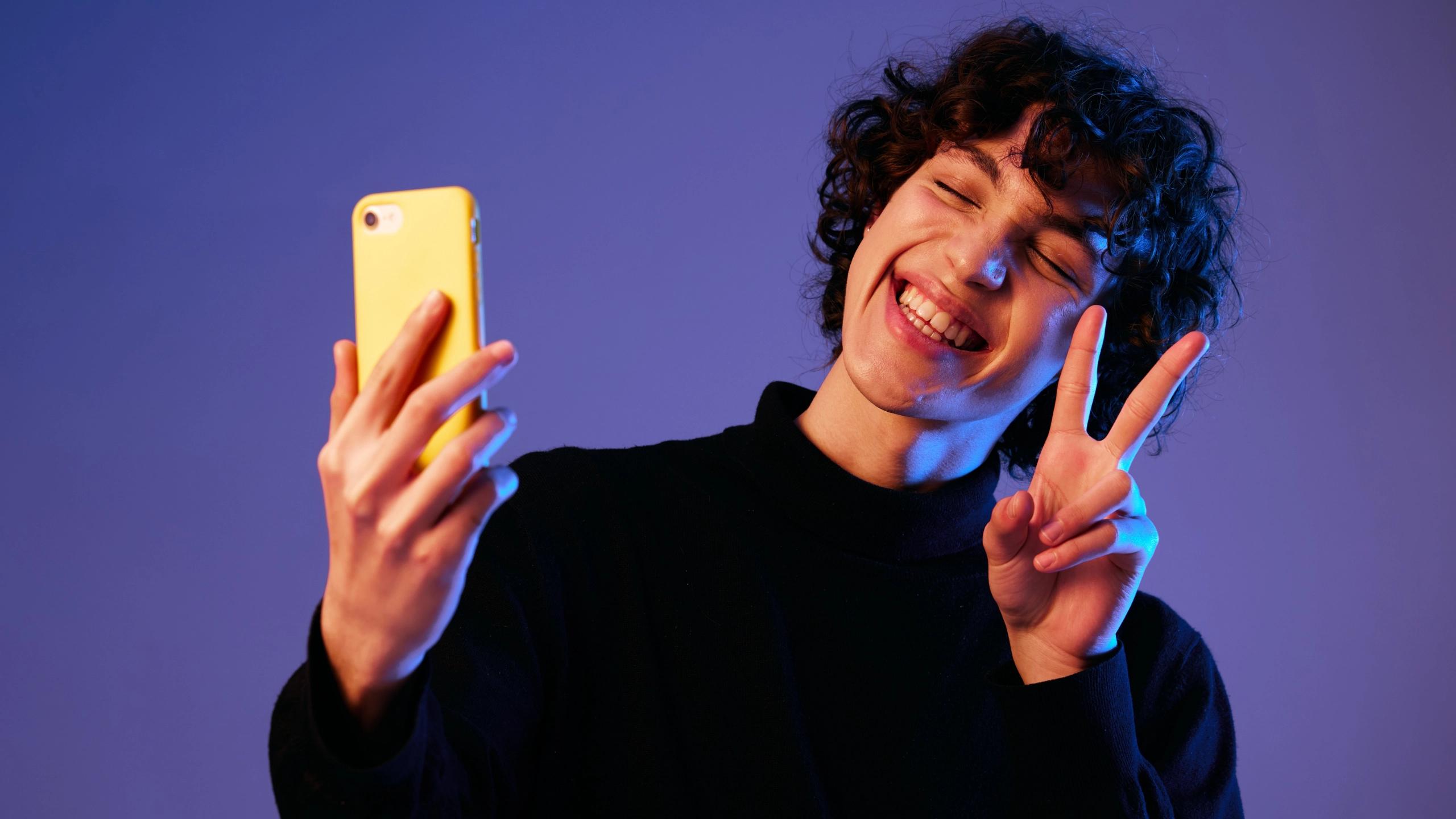 Hand holds smartphone displaying Xperia app screens with GET STARTED button and SCAN bar.