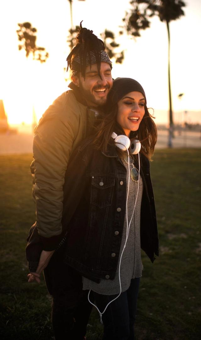 Couple posiong at sunset