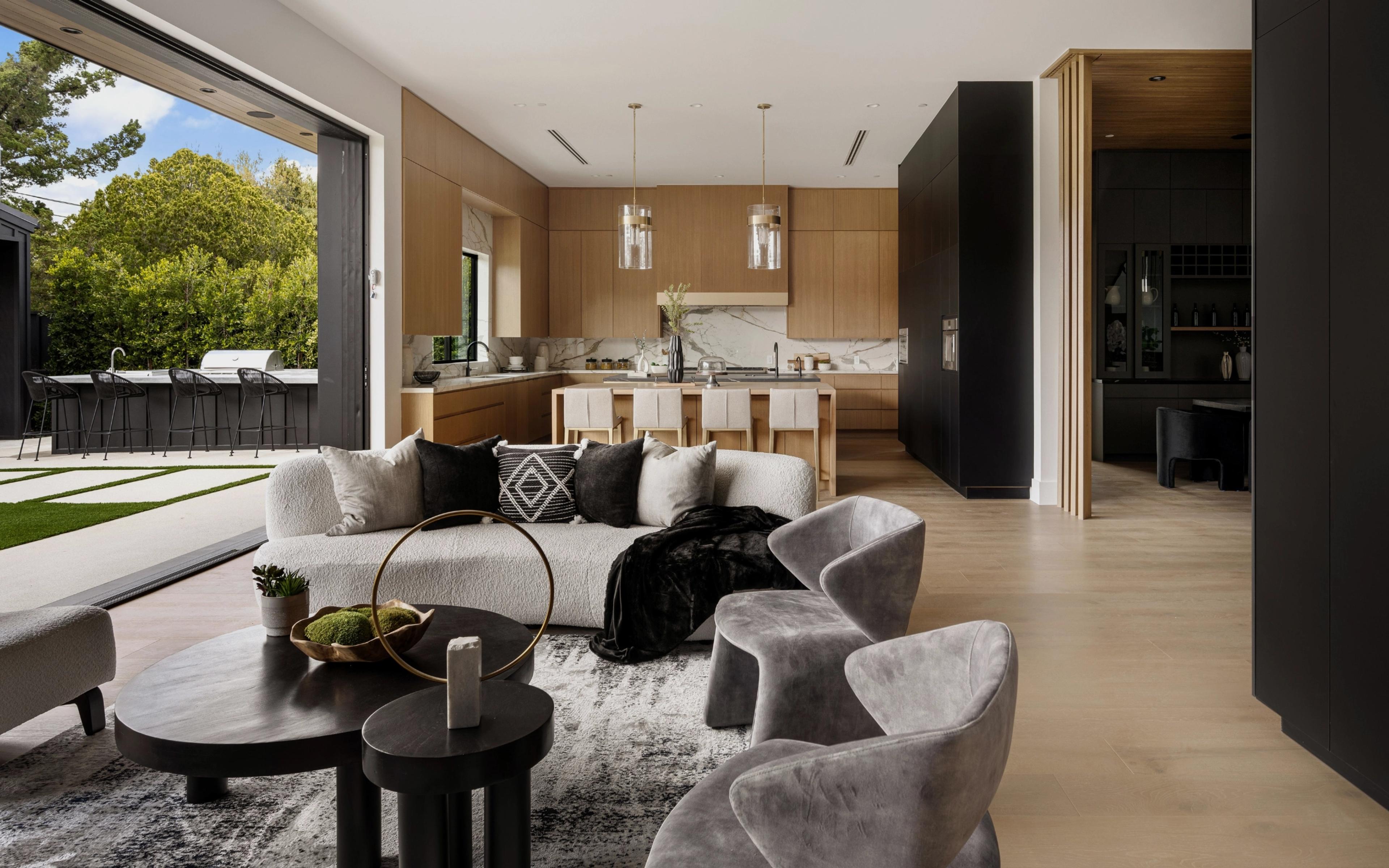Modern open plan living room and kitchen with outdoor area