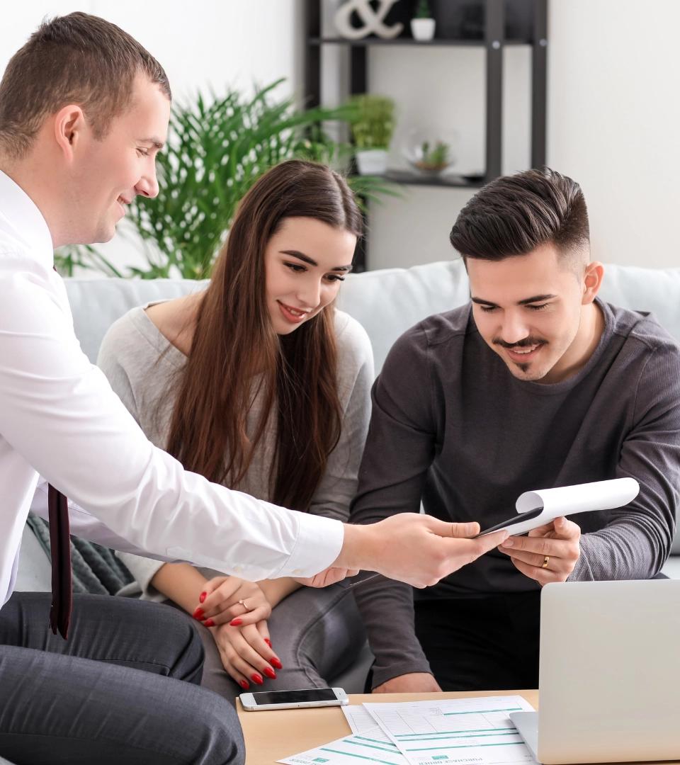 Concveyancer showing docs to couple
