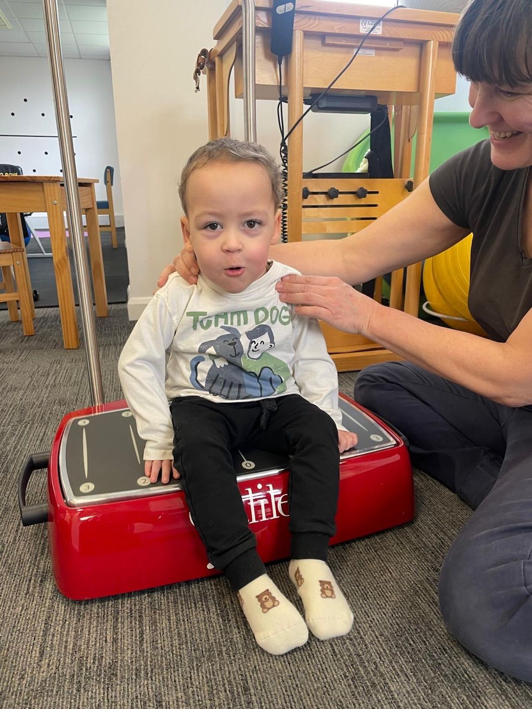 A client using the Galileo vibration plate from a seated position