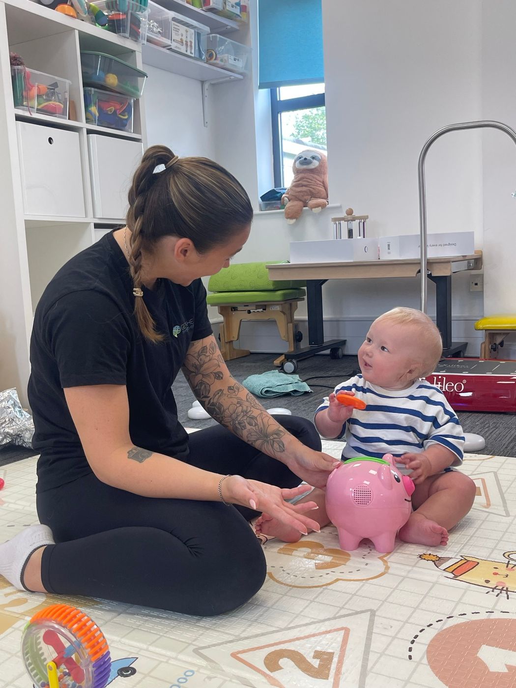 A paediatric physiotherapy session in progress in the clinic play area