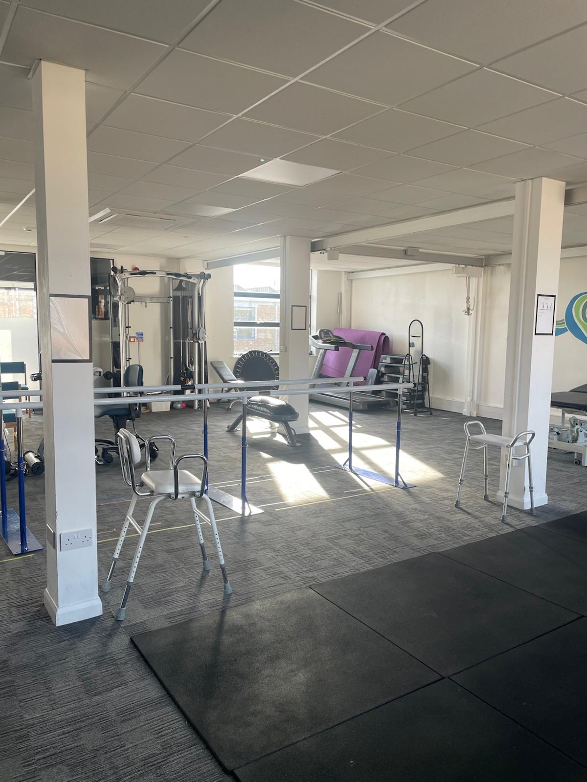 The Get Ahead Physiotherapy clinic entrance, with branded signage, level access and parking directly outside