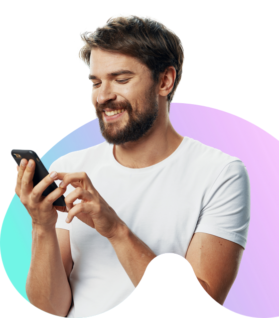 Man using  a mobile phone and smiling in front of a colourful background