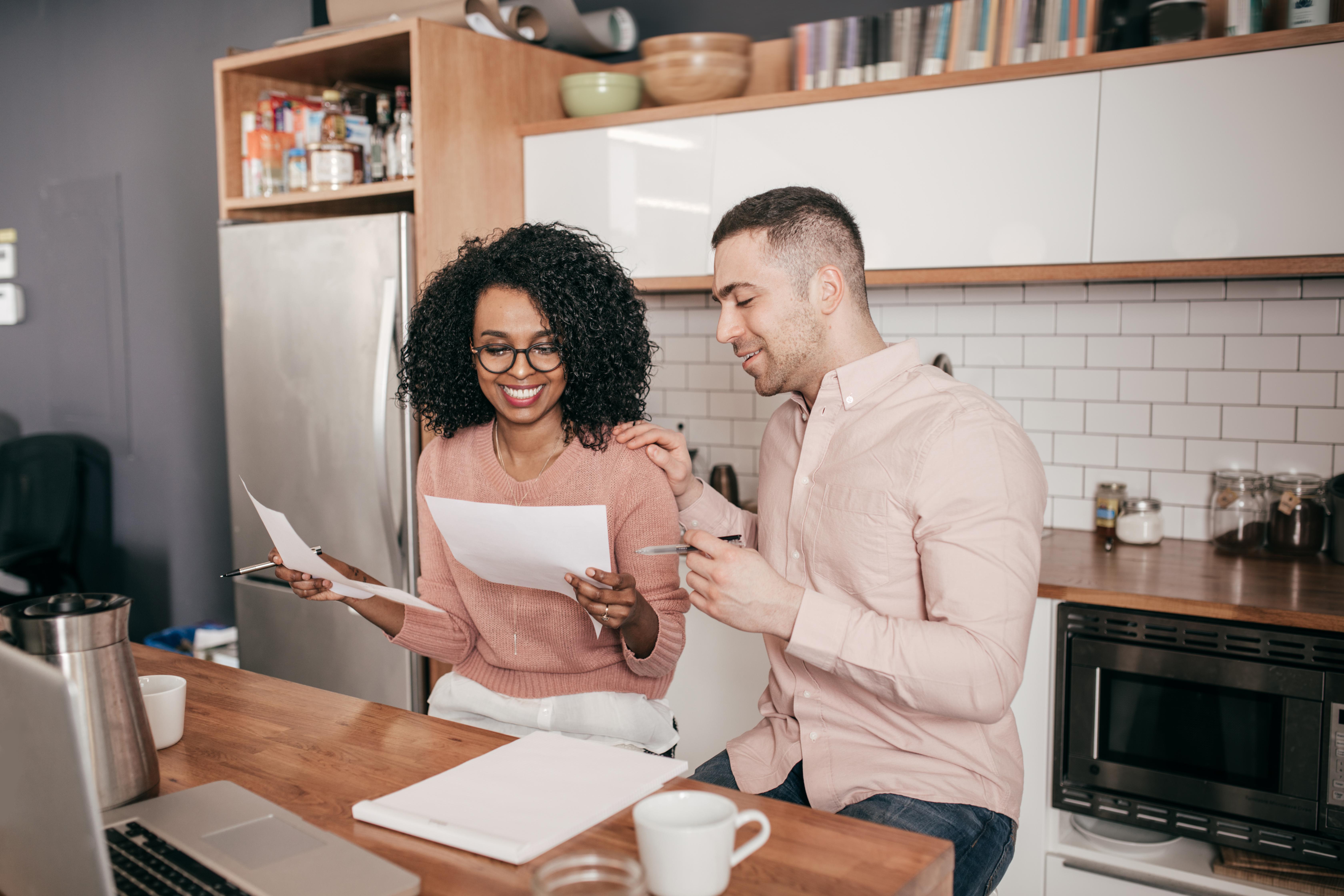 couple at a table remortgaging