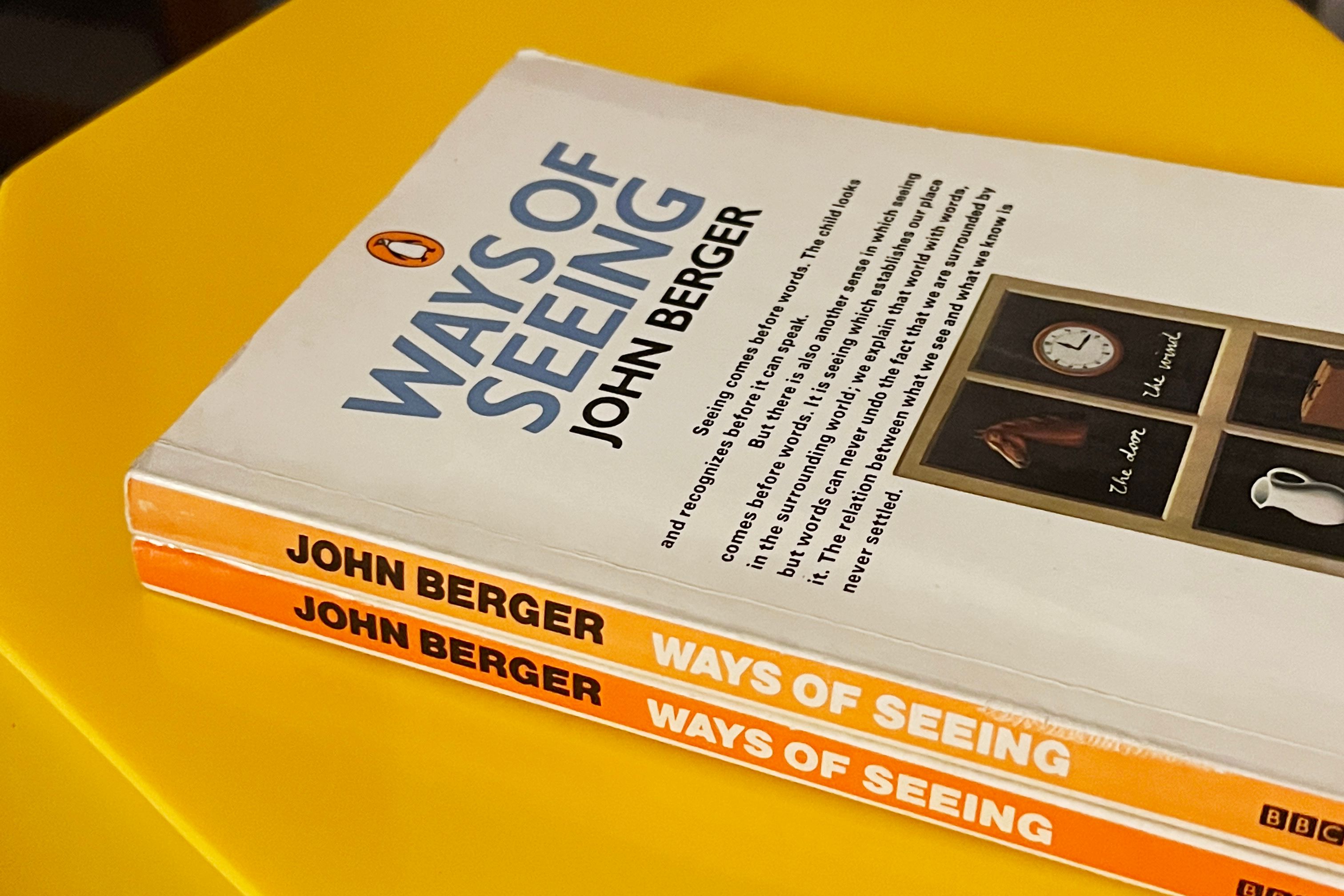 Two copies of the book Ways of Seeing by John Berger on table