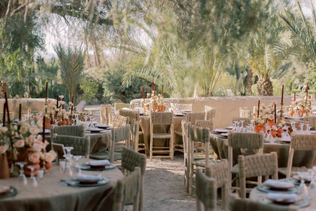 Event coordinators managing elegant Moroccan wedding décor.
