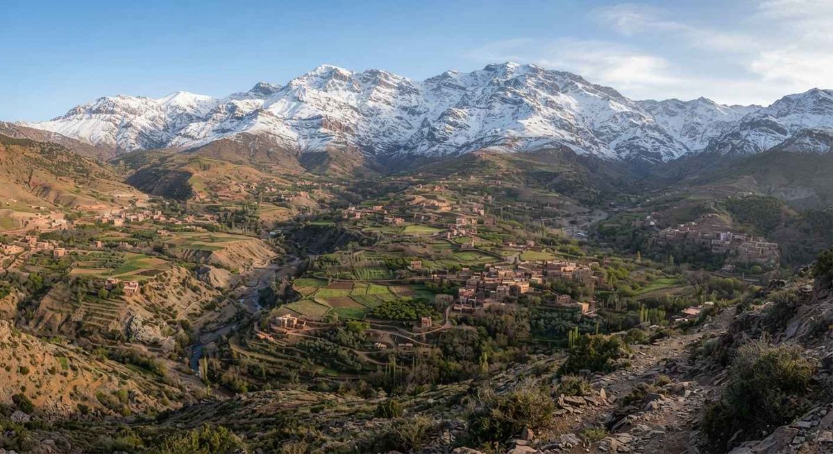 Snow-capped peaks of the Atlas Mountains overlooking a valley in Morocco