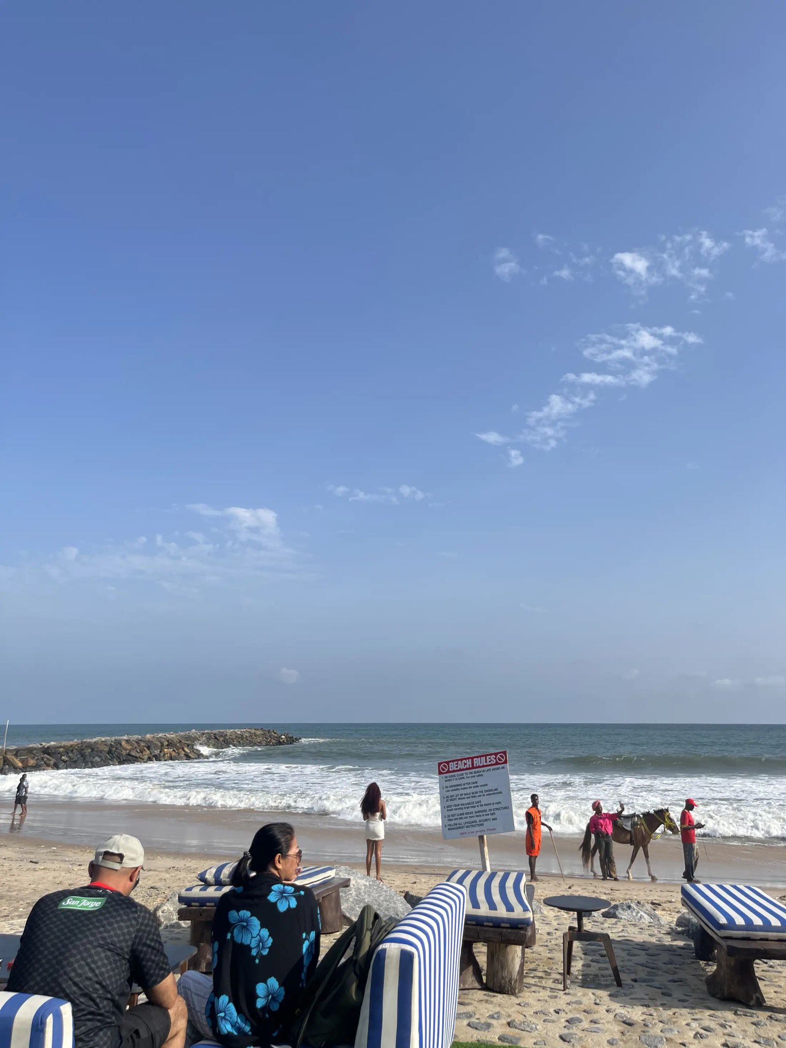 Guests on the beach looking out to sea