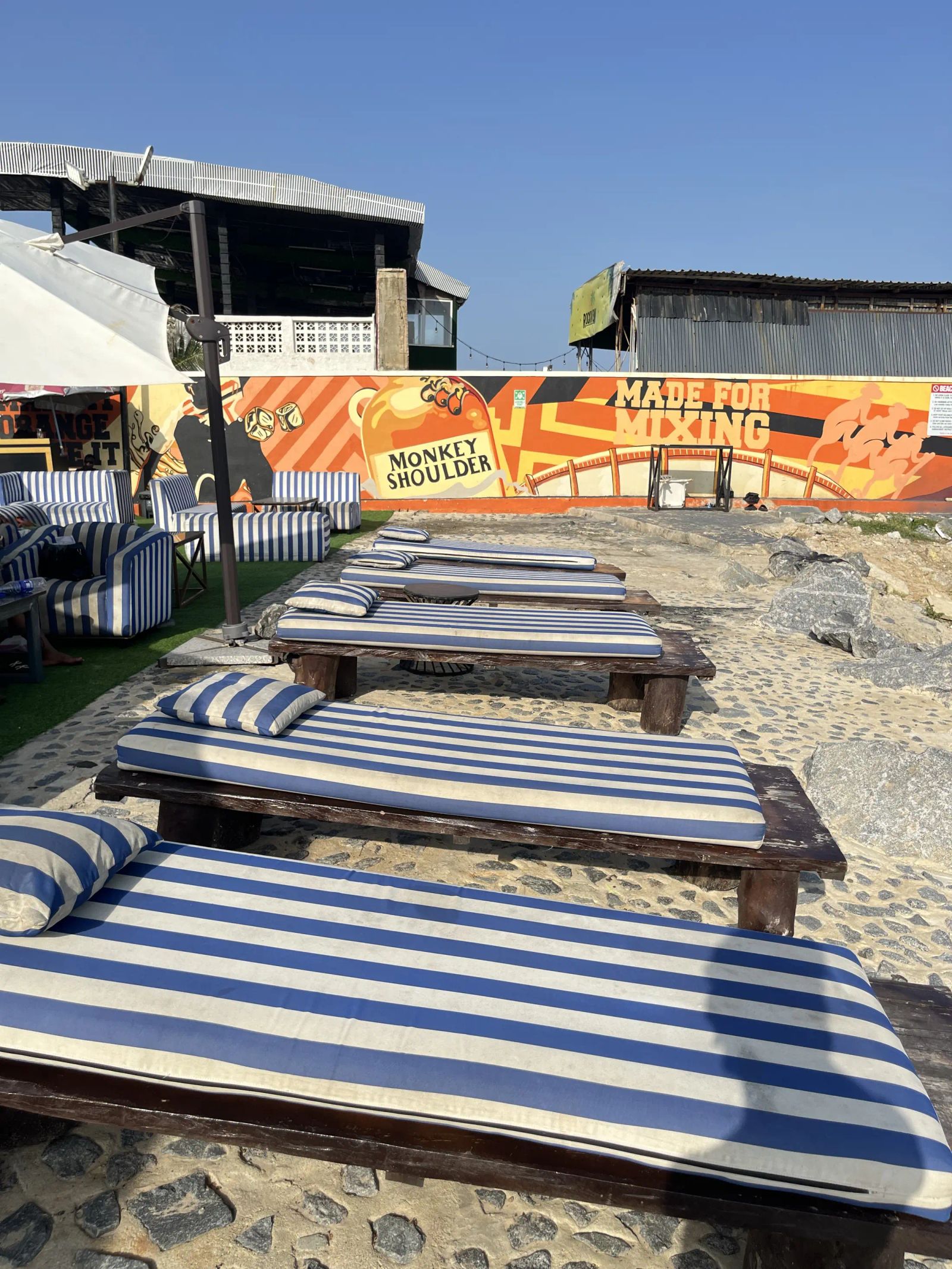 Striped loungers on the sand