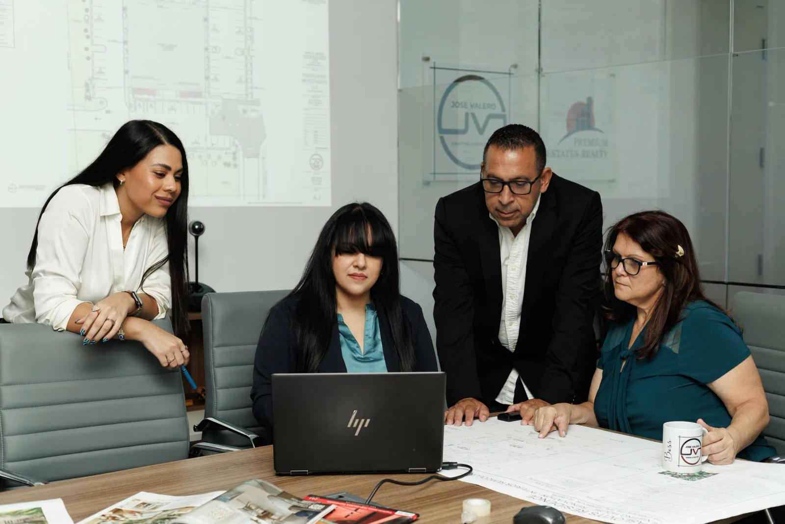 The JV Design Services team collaborating in their Doral studio