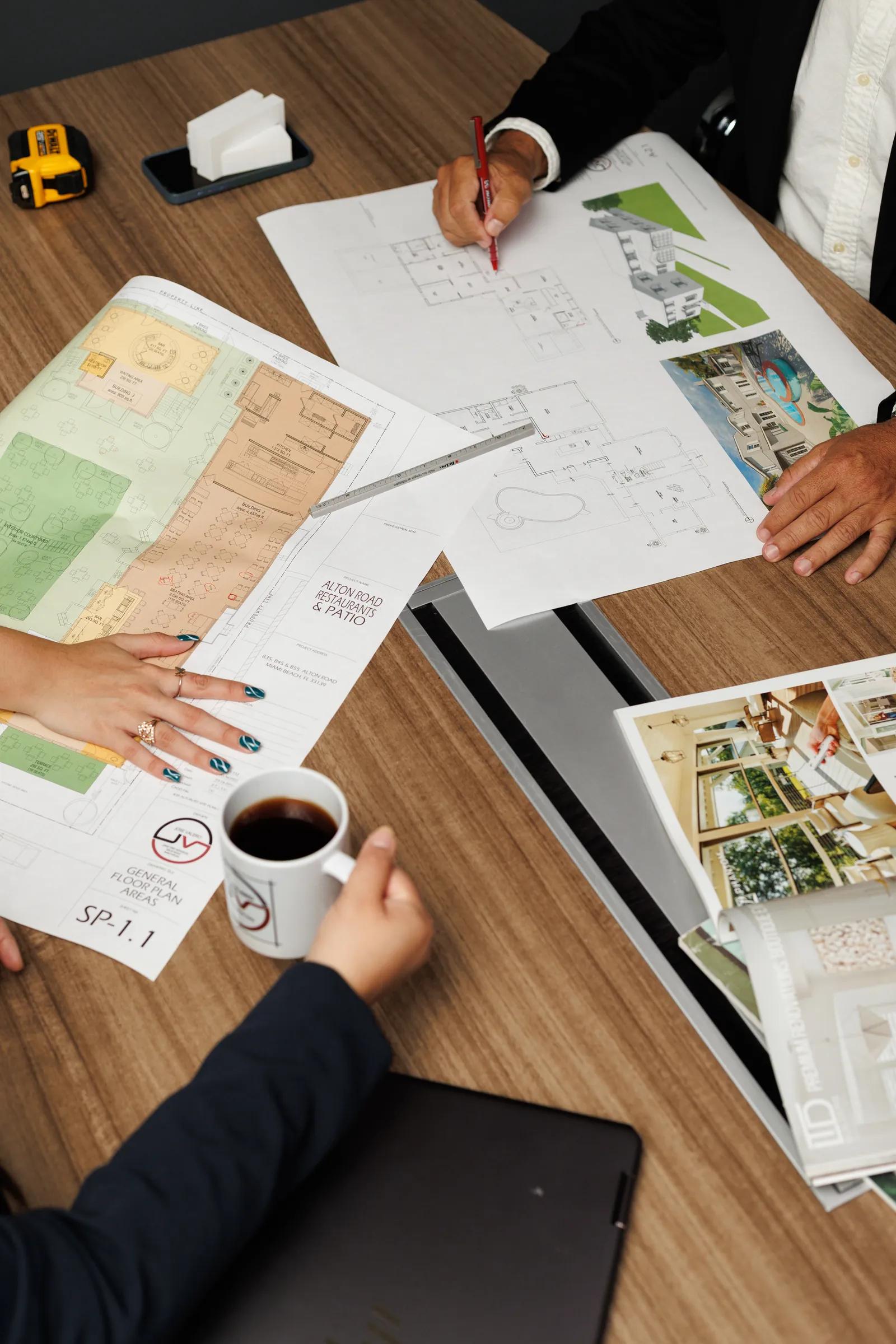 Construction plans, drawings and materials reviewed on a table
