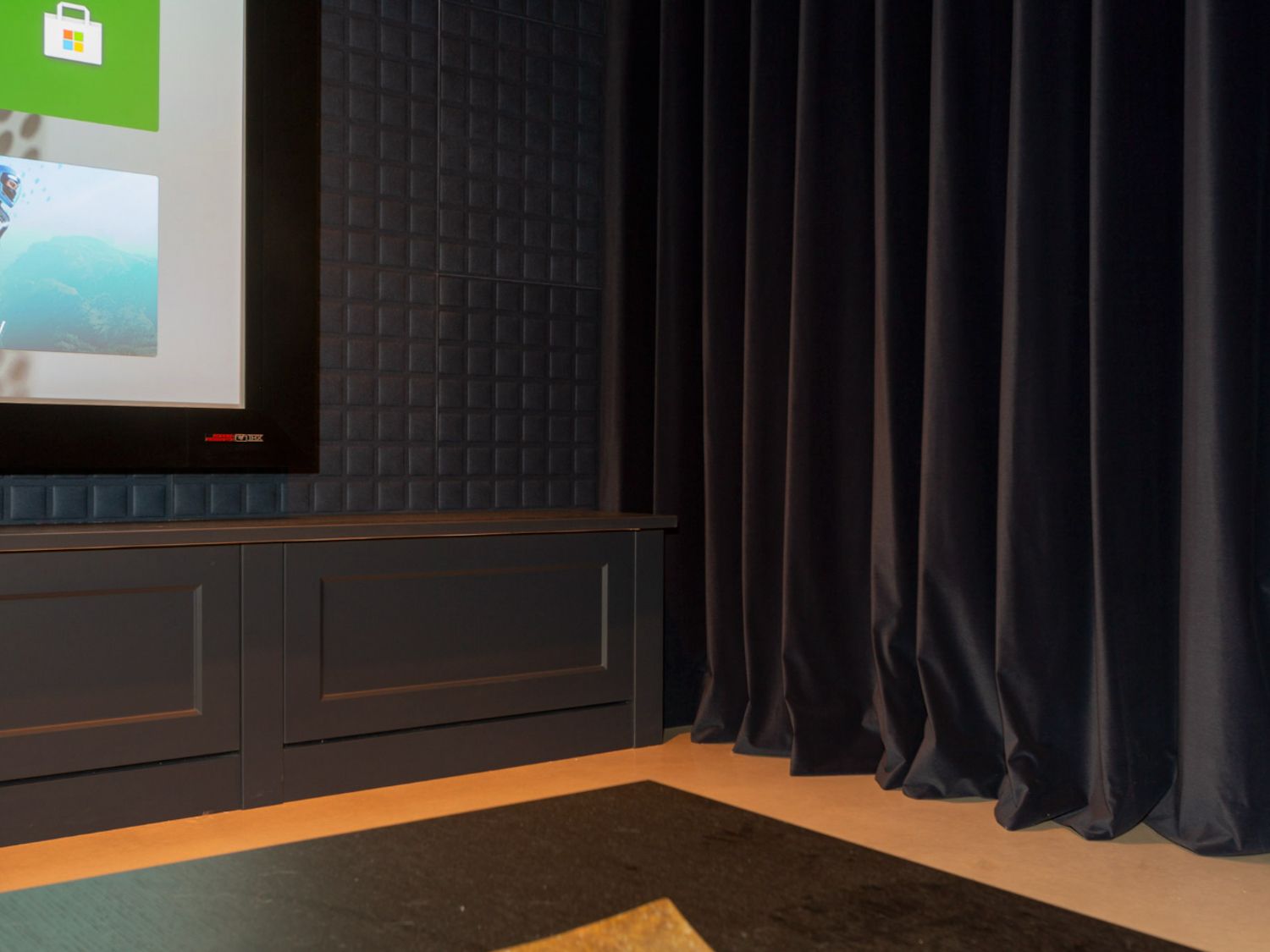 Acoustic treatment of the room including a front wall baffle ensures maximum performance from the audio kit Custom acoustic decorative tiling on home cinema side wall