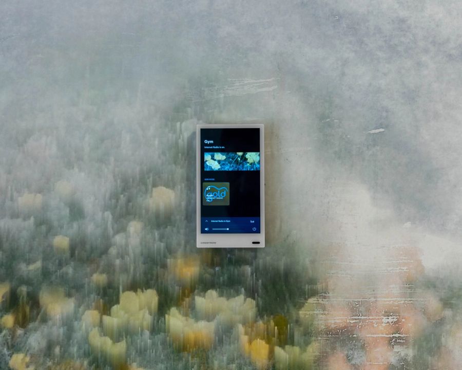 Crestron Touch Screens in Connaught Care Crestron touch screen installed in Connaught Care, showcasing user-friendly home automation controls.