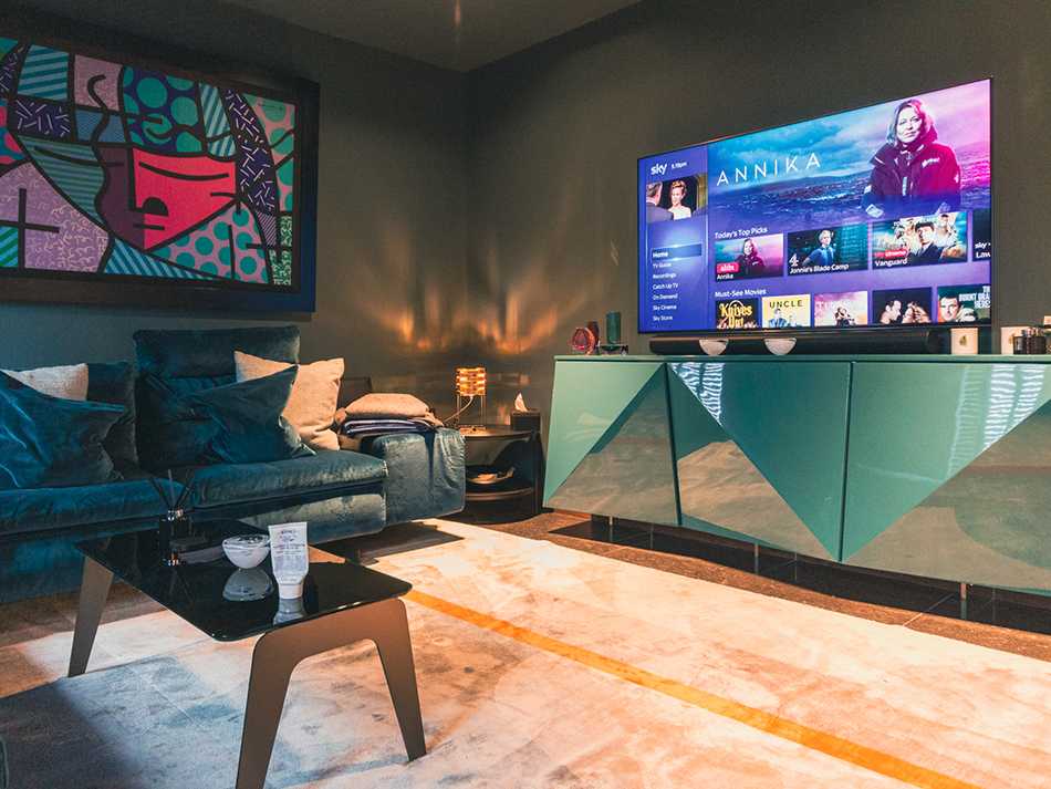 Dedicated media room with large LED TV and surround sound