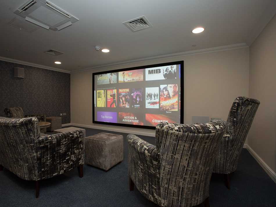 Dedicated cinema room with 4K visuals and 7.1 surround sound