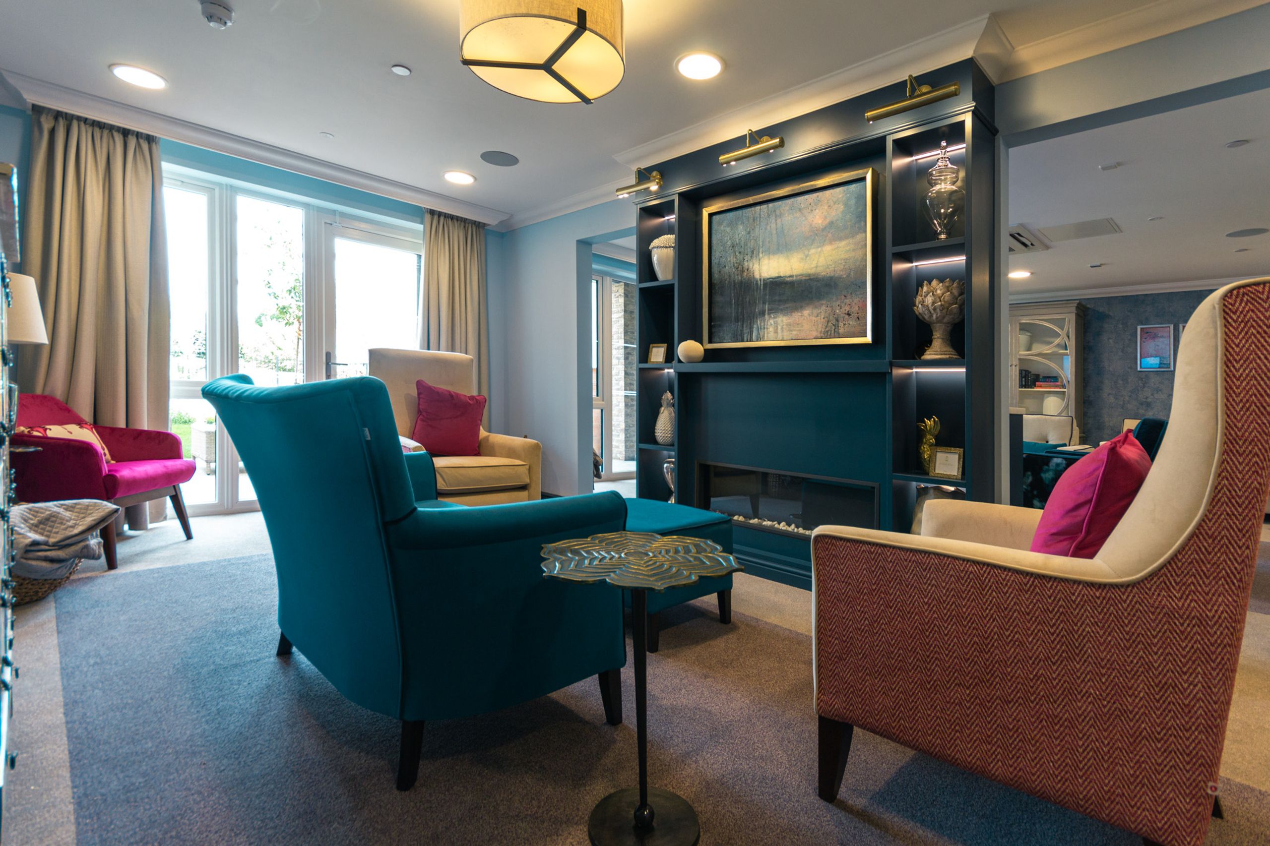 Carehome cinema room with large projector screen.