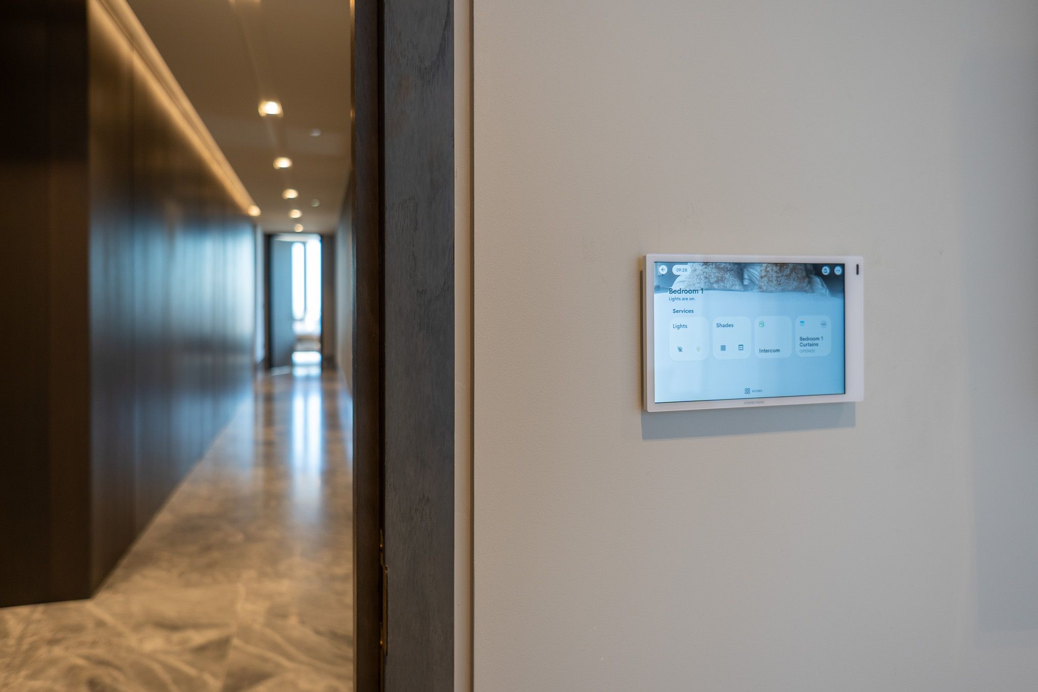 Crestron Home touch screen Wall-mounted Crestron Home touchscreen in the South Bank penthouse corridor