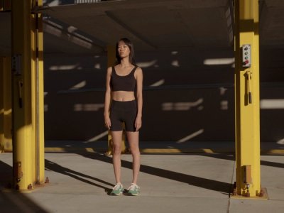 model standing up in industrial area