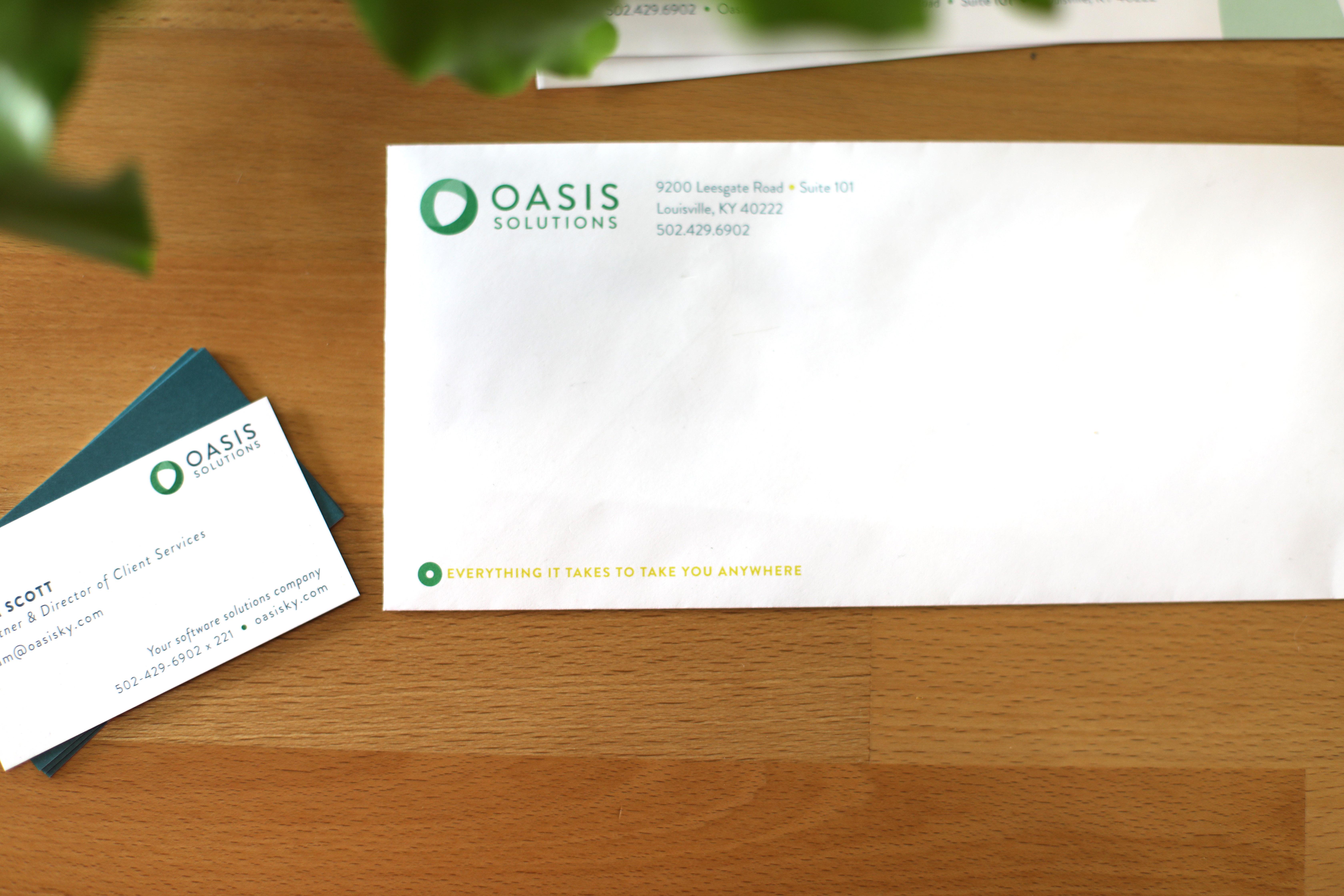 Oasis envelope and business cards.