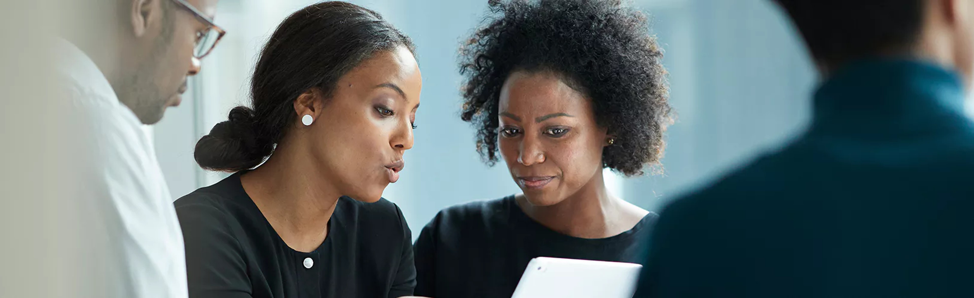 Colleagues discussing HIPAA penalties