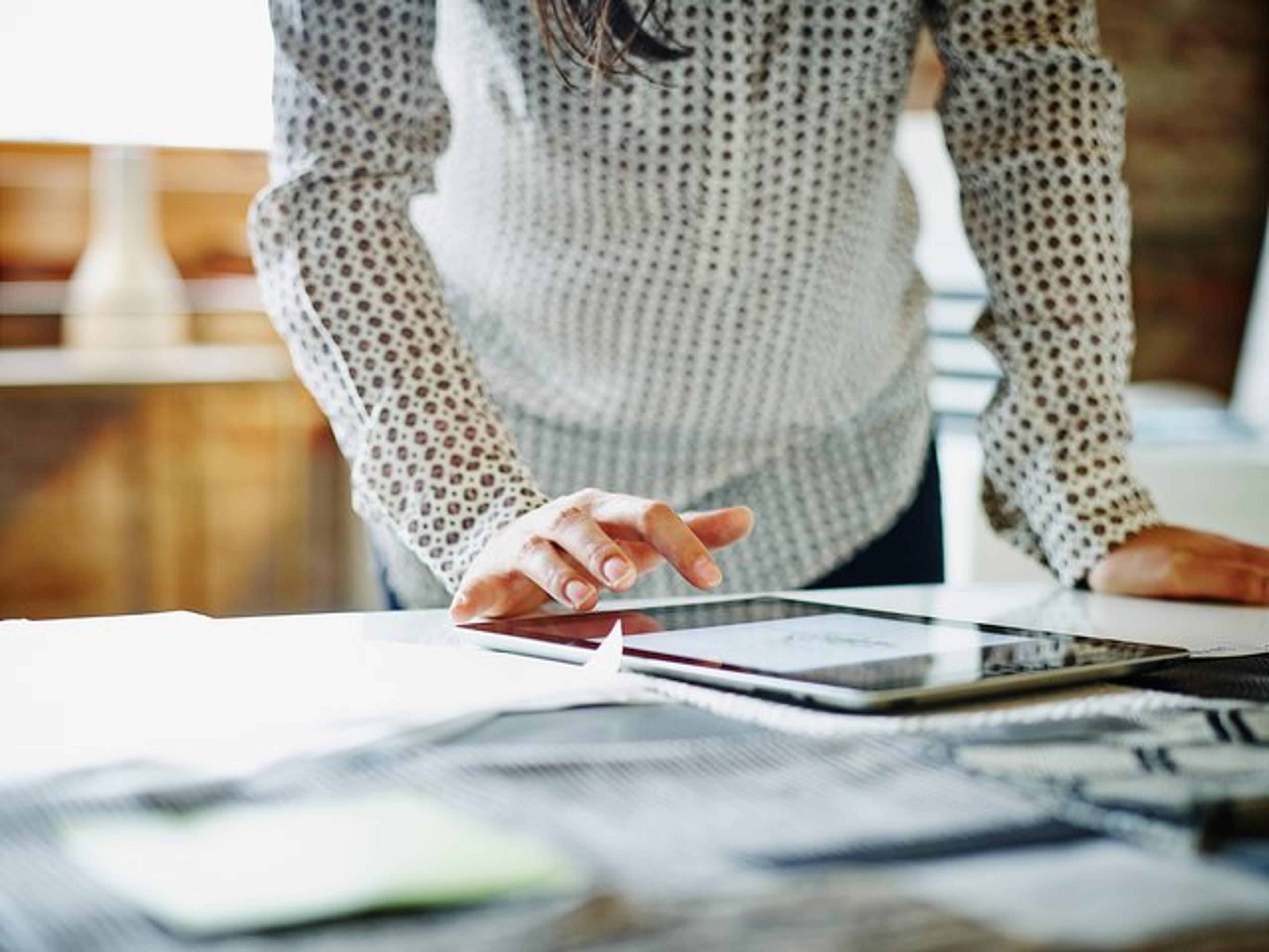 A company secretary reading a guide to improve their IPO roadshow