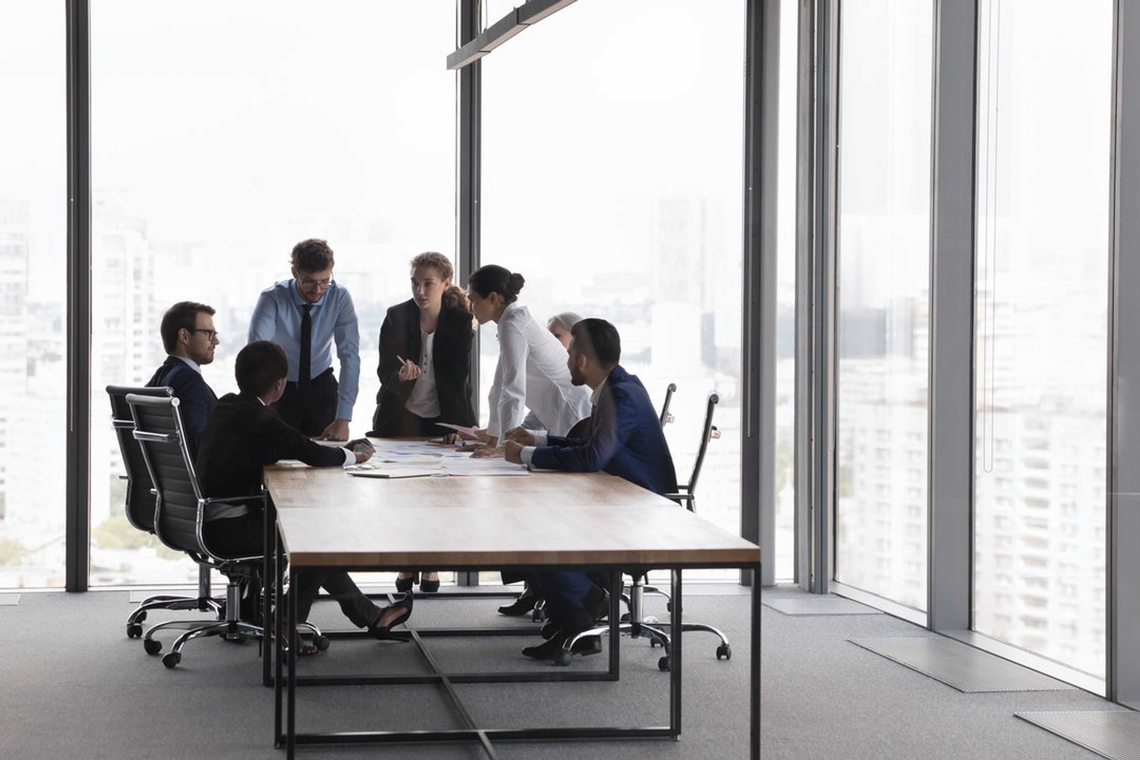 group of people discussing AI GRC, AI-enabled GRC
