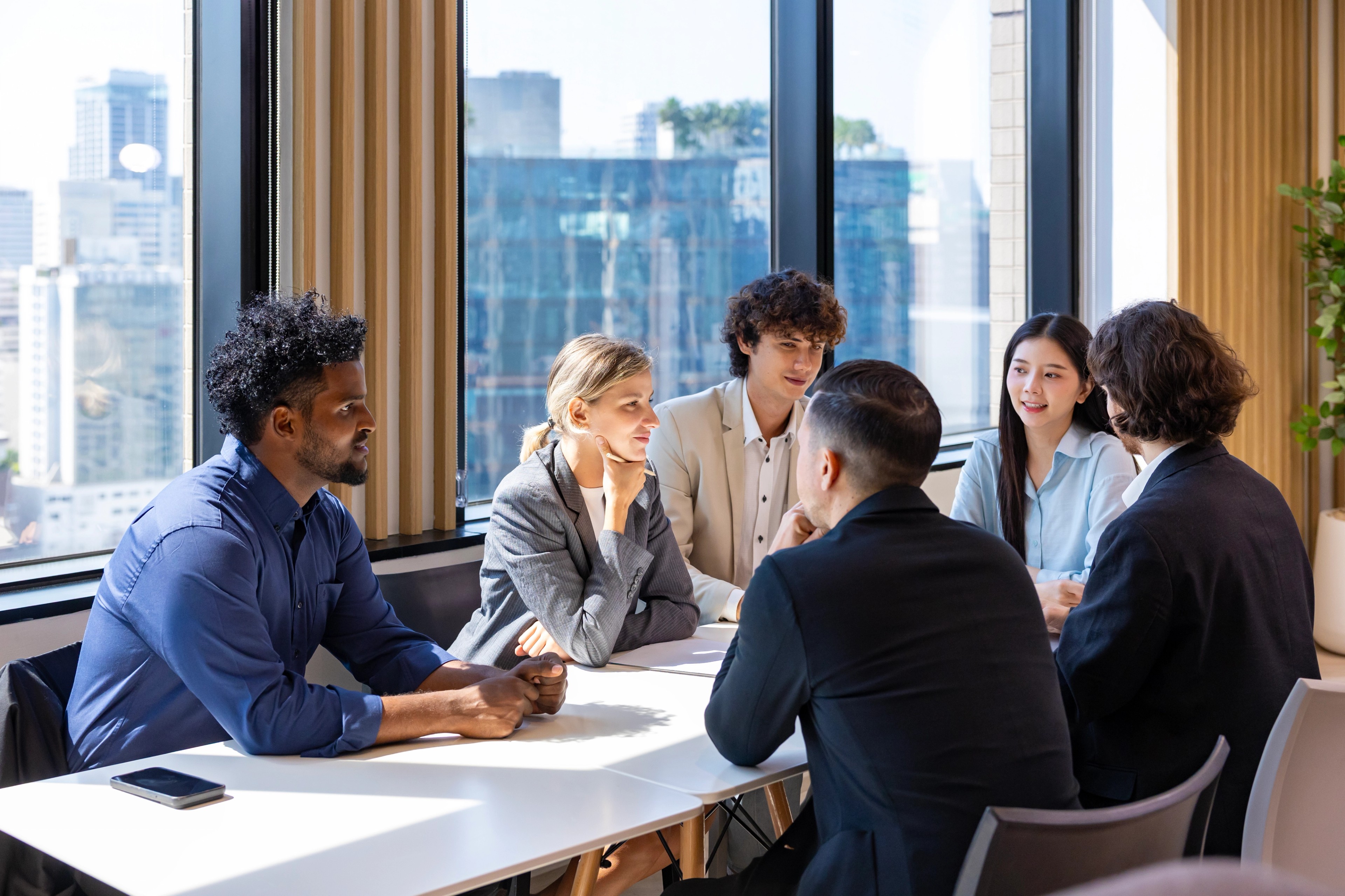 Professionals discussing recent activist campaigns