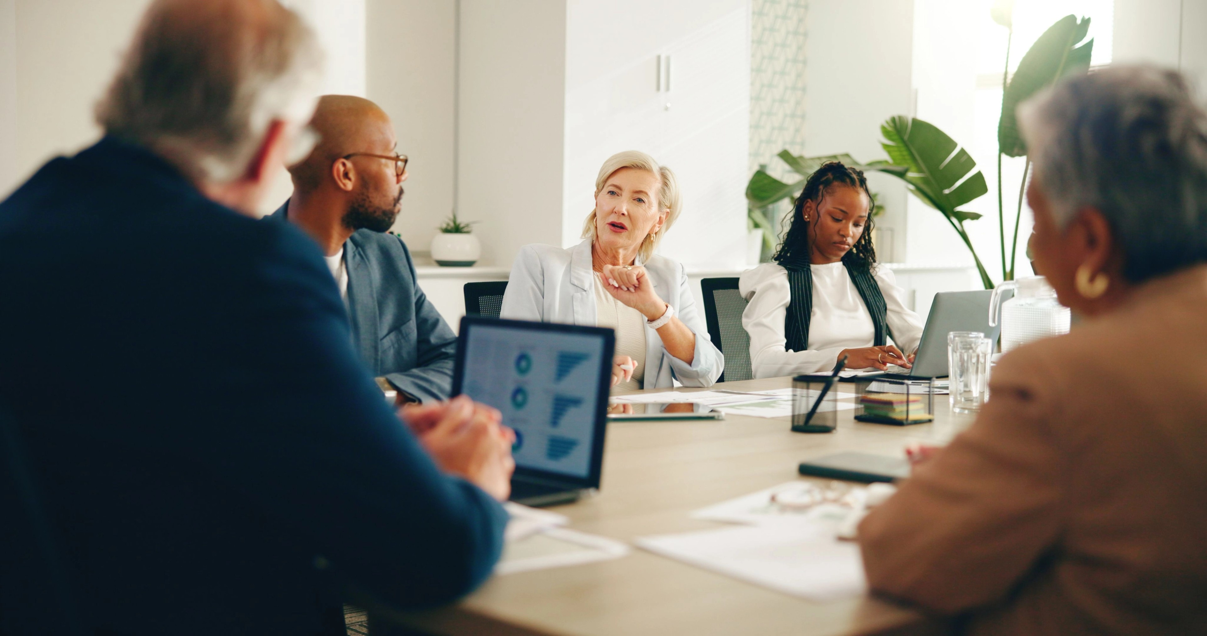 group of people in a meeting discussing cis compliance