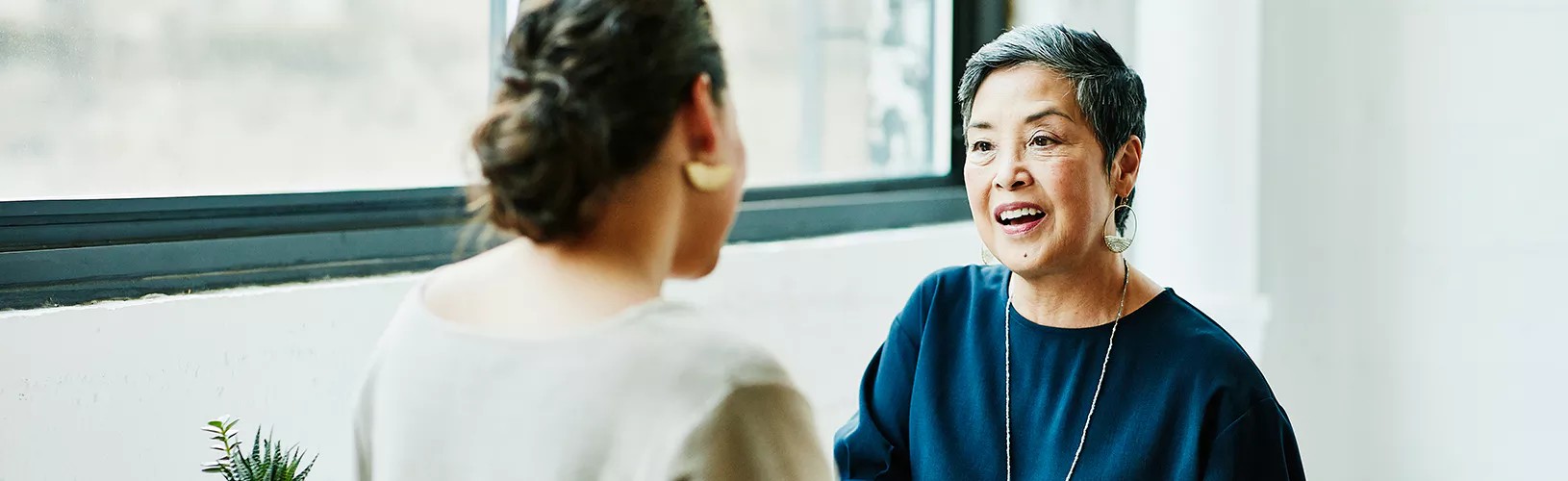 two board members discussing governance trends in Asia