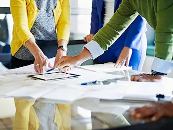 Board members in a meeting with stakeholders