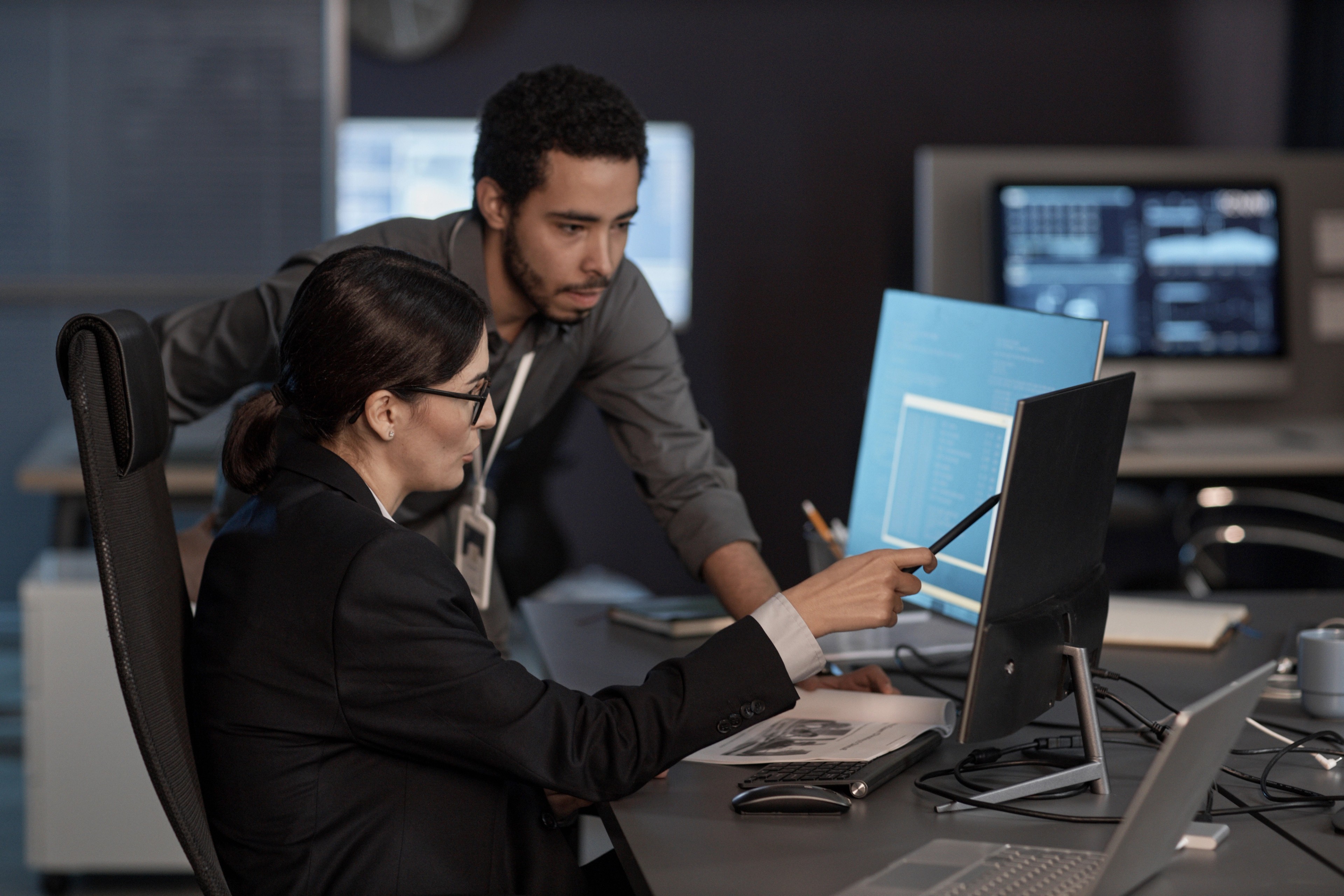 Two people looking at computer screen
