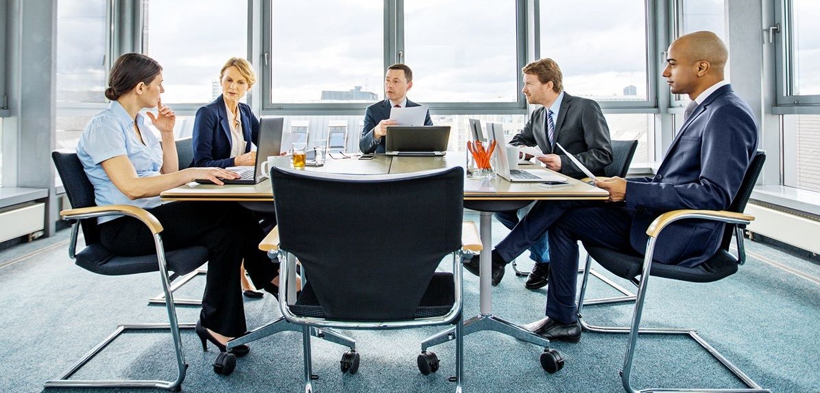 Executives discussing the role of the board of directors in corporate governance