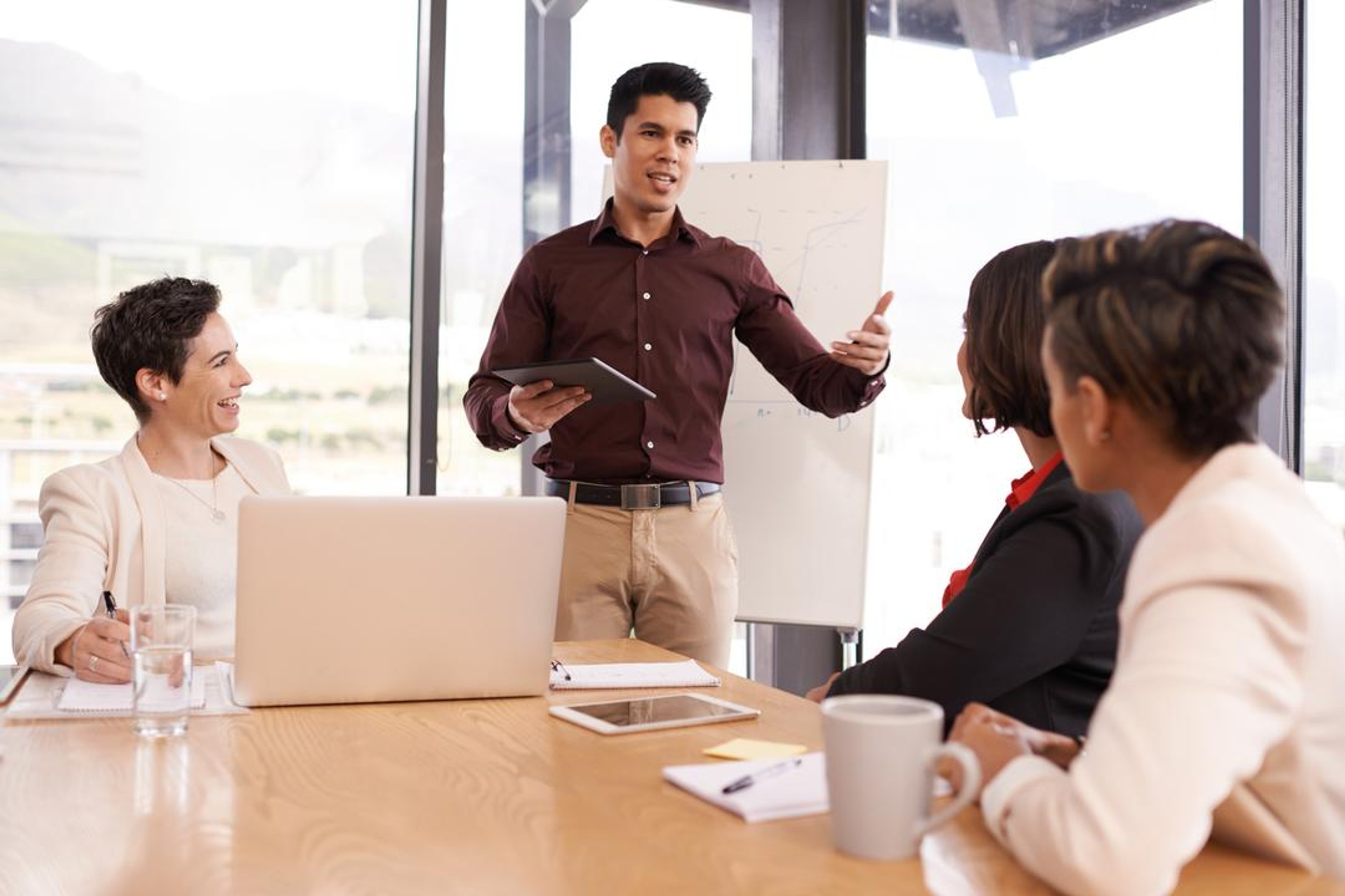 A meeting taking place where effective meeting minutes are being recorded
