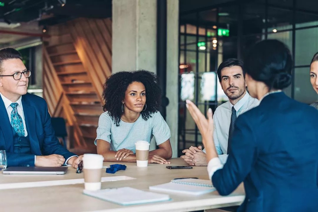 Team mates discussing board of directors responsibilities