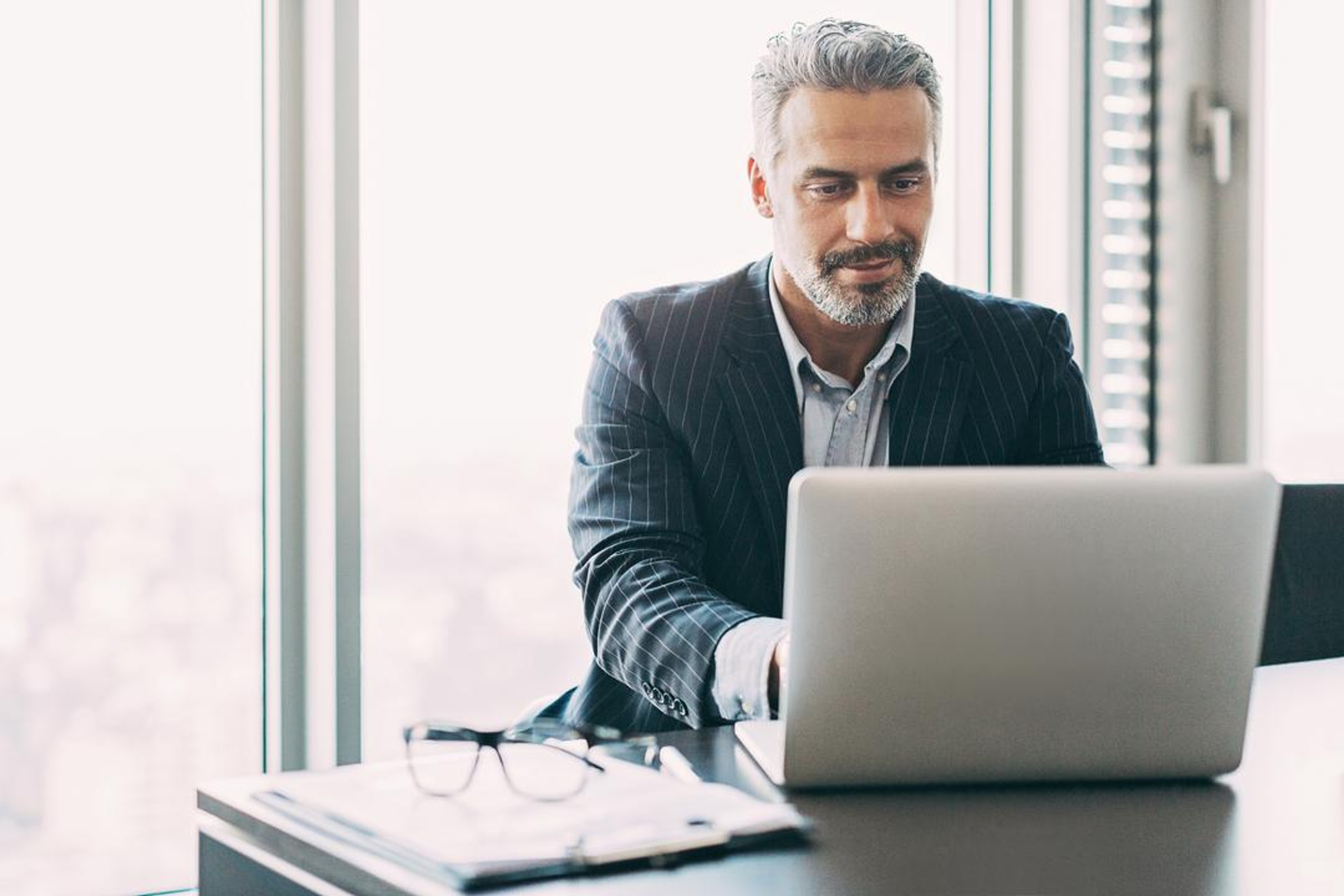 Puzzle of person with switched off light bulbs and one lit lightbulb