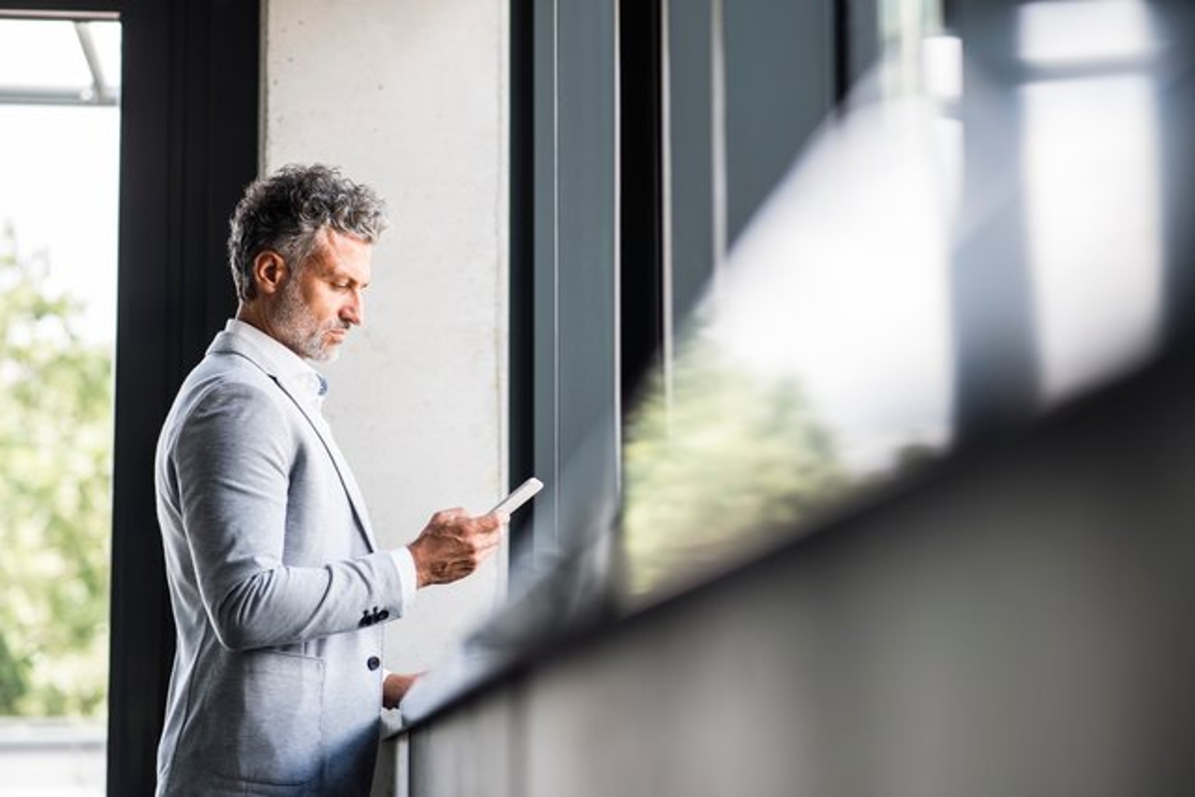A general counsel reading a guide that helps M&A due diligence