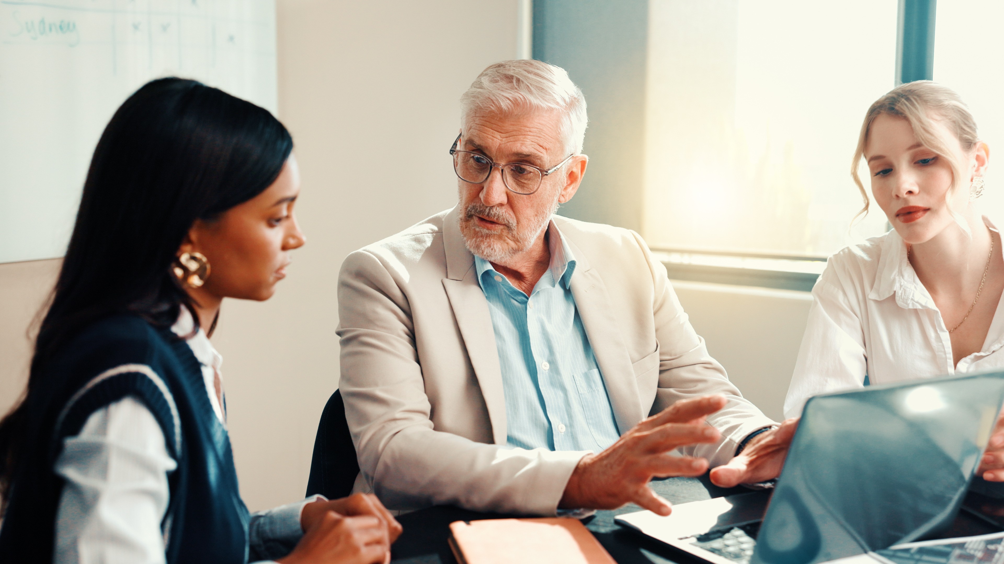 group of people discussing three lines of defense in risk management