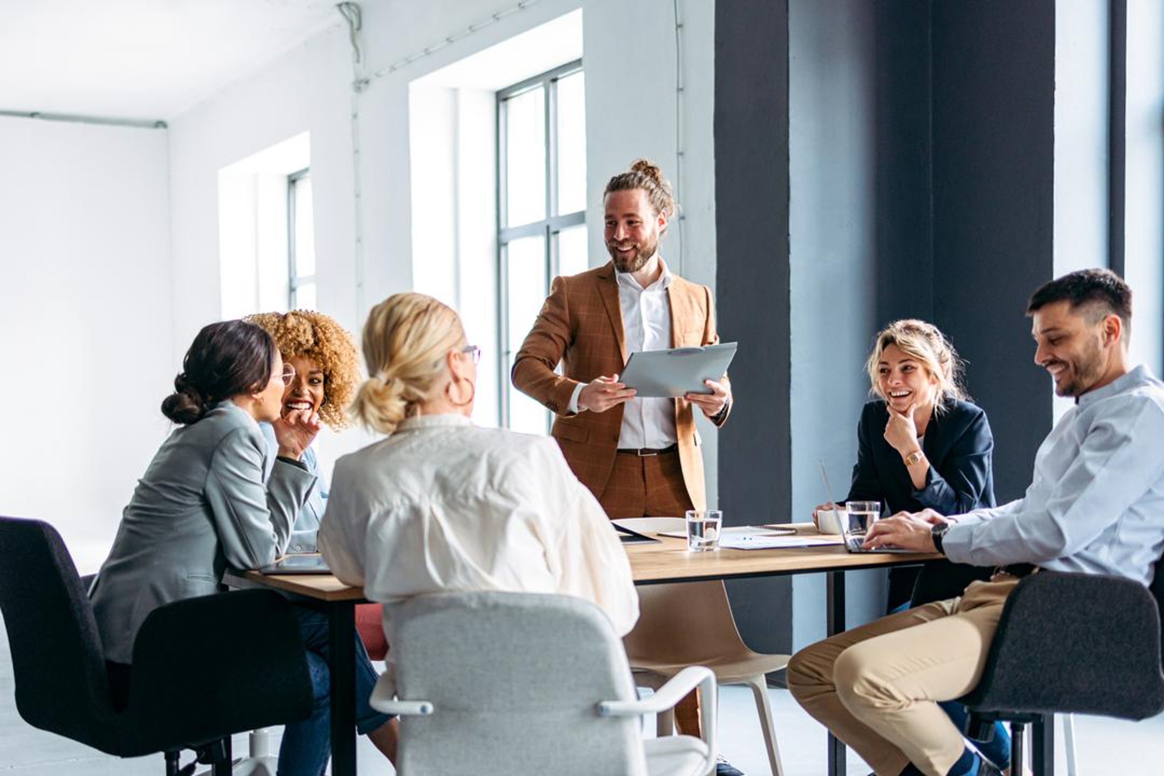 A board meeting with members who followed a guide on how to become a board member